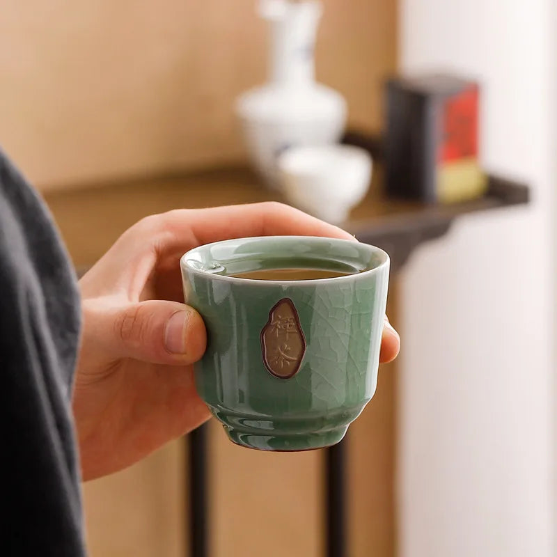 Elegant celadon Kung Fu tea set with ice-crack glaze, perfect for tea lovers and gifting.